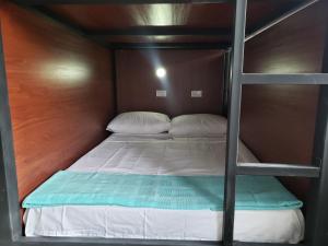 A bed or beds in a room at Aima Ibagué