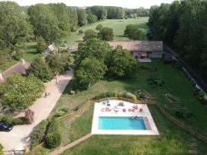 an aerial view of a large yard with a swimming pool at La Ferme des Isles in Authouillet