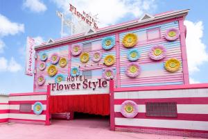 a pink and white house with a flower style at Koriyama Flower Style in Tenri