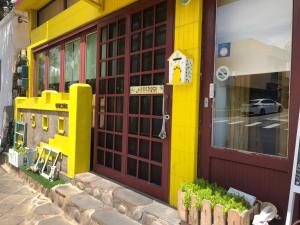 a lego store front with a lego house on the door at Sea House in Magong