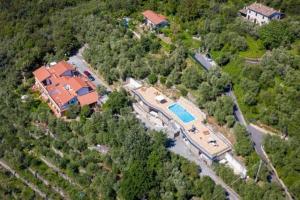 an aerial view of a house with a swimming pool at Villa antonini. in Lerici +3 photos