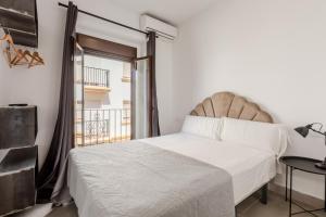 Postel nebo postele na pokoji v ubytování Villamarta Boutique Rooms