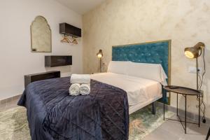 Postel nebo postele na pokoji v ubytování Villamarta Boutique Rooms