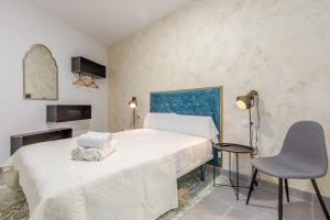 Postel nebo postele na pokoji v ubytování Villamarta Boutique Rooms