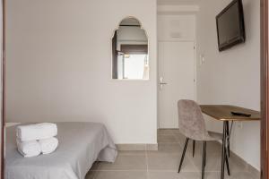 TV a/nebo společenská místnost v ubytování Villamarta Boutique Rooms
