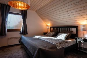 Postel nebo postele na pokoji v ubytování Villa Jasen