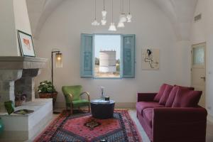
a living room filled with furniture and a couch at Masseria Palombara Resort & SPA - Adults only in Manduria
