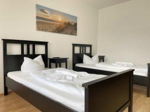 Ένα ή περισσότερα κρεβάτια σε δωμάτιο στο SAD161 - Gut geschnittene Monteurwohnung mit Balkon