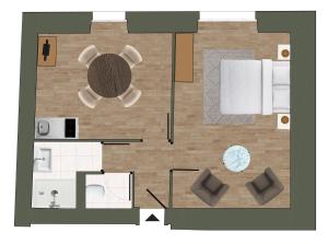 a floor plan of a room with a table at Logis Vélès in Aubin