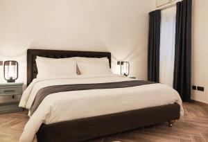 Postel nebo postele na pokoji v ubytování Casa Reale Boutique Hotel