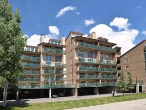 a large apartment building with balconies on a street at Vantage Point #209 Condo in Vail +8 photos