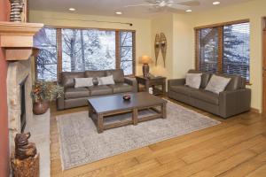 a living room with a couch and a coffee table at Aspenwood Lodge #201 Condo in Edwards