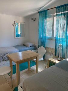Postel nebo postele na pokoji v ubytování Apartments Skalin