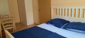 Postel nebo postele na pokoji v ubytování Apartments Skalin