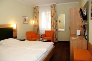 TV a/nebo společenská místnost v ubytování Hotel Zur Mühle