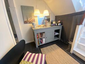 a small living room with a table and a couch at Comfortable Large Room King S bed near CPH centre in Copenhagen