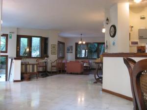 a living room with a kitchen and a dining room at Aiolos in Loutra Edipsou