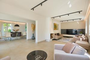 a living room with a couch and a table at Hedera Estate, Villa Hedera III in Zaton