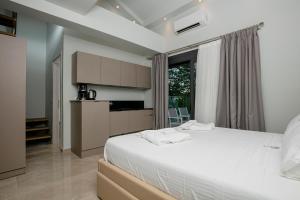 Posteľ alebo postele v izbe v ubytovaní B&D Luxury Suites