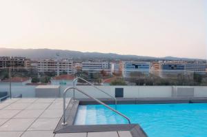 a swimming pool on the roof of a building at Soho Boutique Córdoba in Córdoba