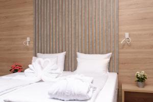 Postel nebo postele na pokoji v ubytování Holiday Park Zagyland