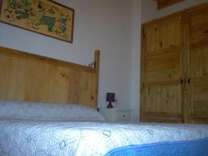 Posteľ alebo postele v izbe v ubytovaní Apartamento El Dragon Serrano