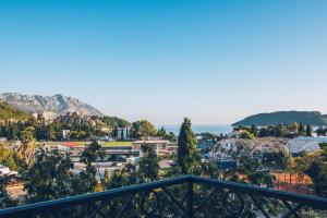 a view of a city from a balcony at Iberostar Waves Slavija in Budva