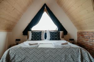 Posteľ alebo postele v izbe v ubytovaní Osada Witów - apartament „Czerwone Wierchy”
