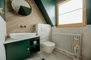 Kúpeľňa v ubytovaní Osada Witów - apartament „Czerwone Wierchy” + 17 fotografií
