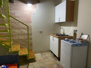 Kuchyň nebo kuchyňský kout v ubytování B&B La Dimora del Contadino
