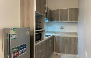 Kuchyň nebo kuchyňský kout v ubytování Al-Haramain Family Apartments
