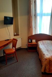 מיטה או מיטות בחדר ב-Nasz Klub - Pokoje Gościnne