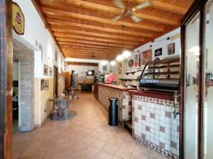 a kitchen with a counter in a restaurant at HOTEL FIORE & Fiocchi in Podenzano