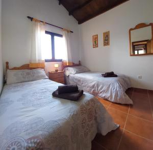Łóżko lub łóżka w pokoju w obiekcie Casa Nisamarita by Sea You There Fuerteventura