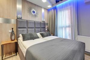 Llit o llits en una habitació de Dom & House - Apartments Waterlane Island