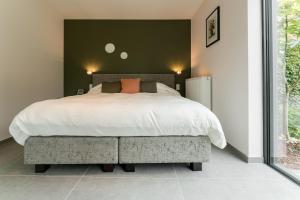 Postel nebo postele na pokoji v ubytování B&B Tannerie