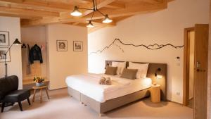 Llit o llits en una habitació de Hotel Soyka