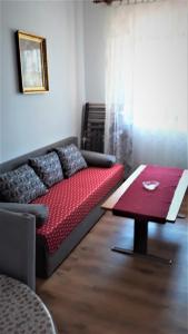 a living room with a couch and a table at Apartment Modric in Senj