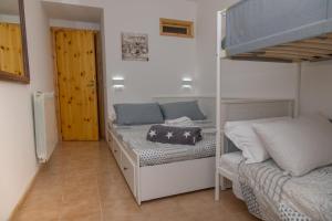 A bed or beds in a room at GreenHouse