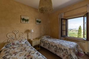 A bed or beds in a room at Agriturismo Percenna