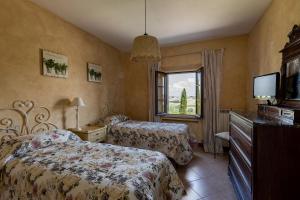 A bed or beds in a room at Agriturismo Percenna