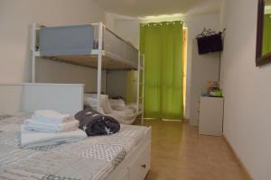 A bed or beds in a room at GreenHouse