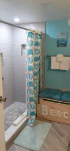 a bath room with a toilet and a sink at Daytona Beach Hawaiian Inn in Daytona Beach