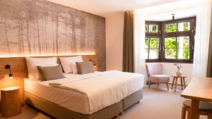 Llit o llits en una habitació de Hotel Soyka