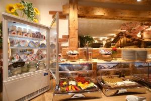 an open refrigerator filled with lots of food at Hotel Eder Michaela in Saalbach-Hinterglemm