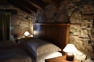 Postel nebo postele na pokoji v ubytování Cascina Belvedì