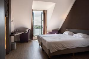 Postel nebo postele na pokoji v ubytování Hotel Hoogeerd by Flow Niftrik - Nijmegen
