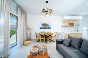 a living room with a couch and a table at Videre Luxury Suites in Potos