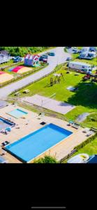 an aerial view of a park with three pools at Ylserod Camping in Strömstad