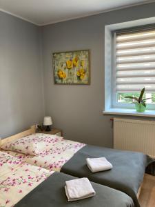 Postel nebo postele na pokoji v ubytování Hostel Karpacki Szymon Szczepan